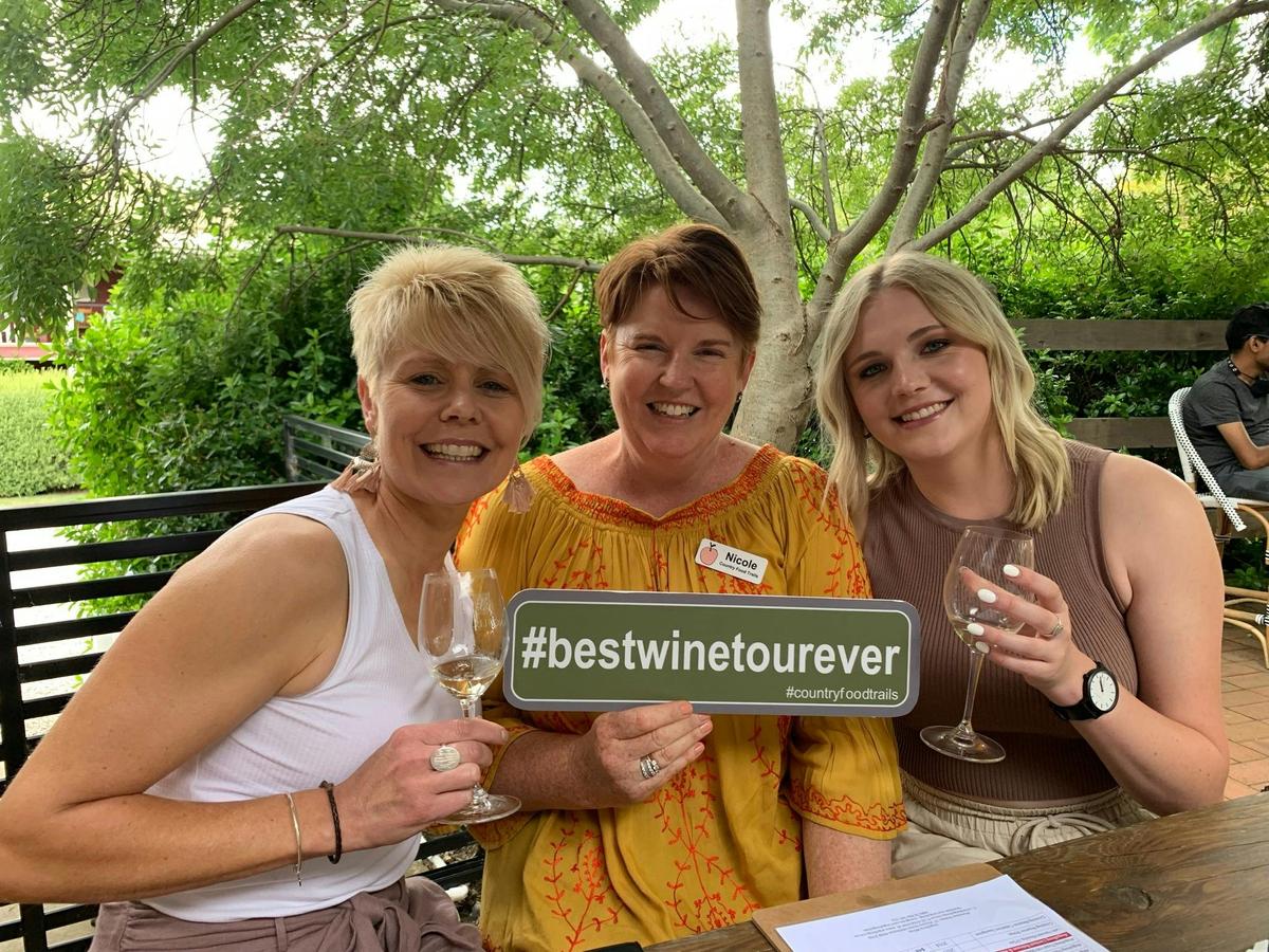 3 ladies drinking wine