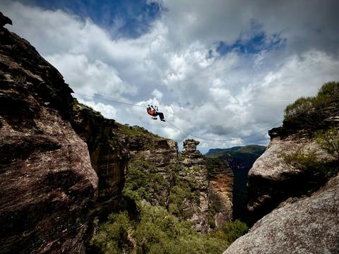 Paraplegic Climber Traversing back to Main cliffline after his Climb