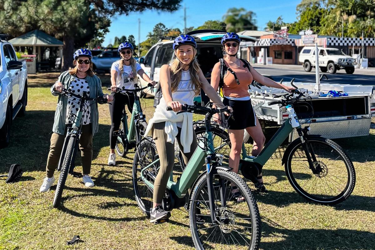 Group of E Bike riders on Husk Distillery and Northern Rivers Rail Trail E Bike tour leaving Mooball