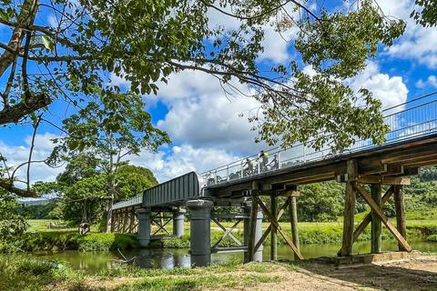 E Bike riders crossing the historic Mills Creek bridge on the Northern Rivers Rail Trail