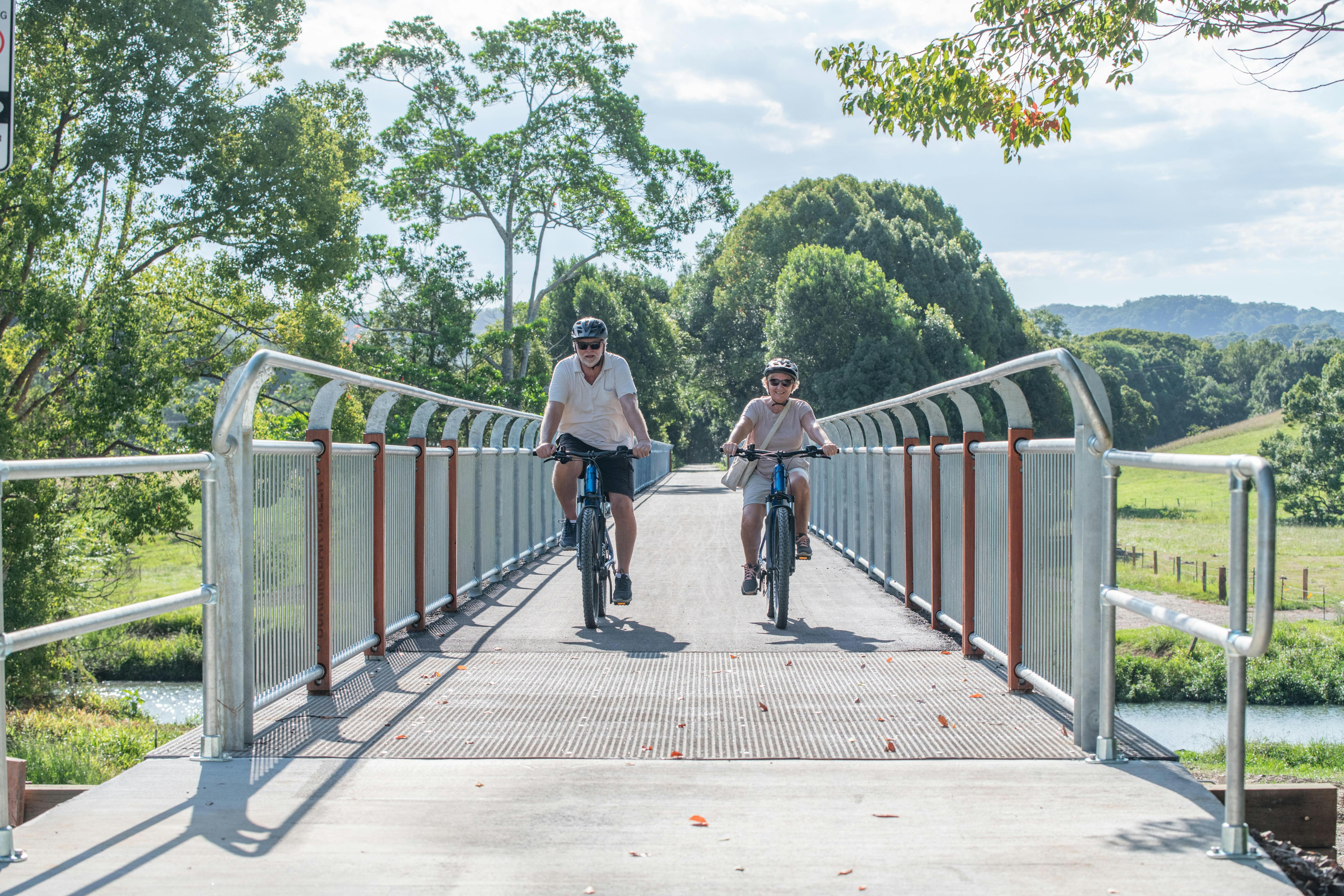 Riders crossing the longest Rail bridge on the Northern Rivers Rail Trail with Better By Bike