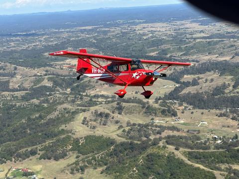 Mid air photo of the Super Decathlon