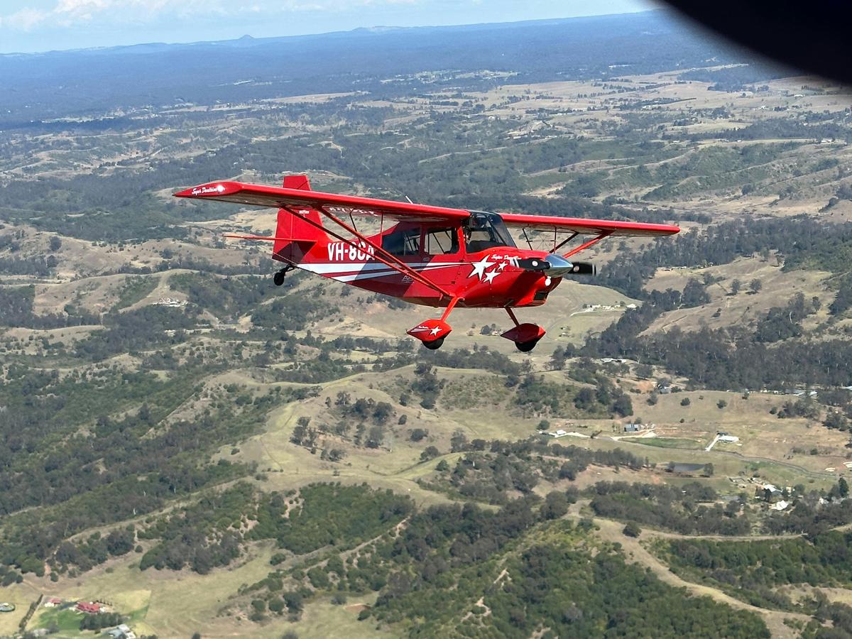 Mid air photo of the Super Decathlon