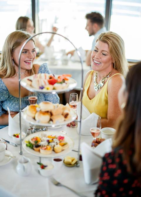 High Tea girls enjoying food