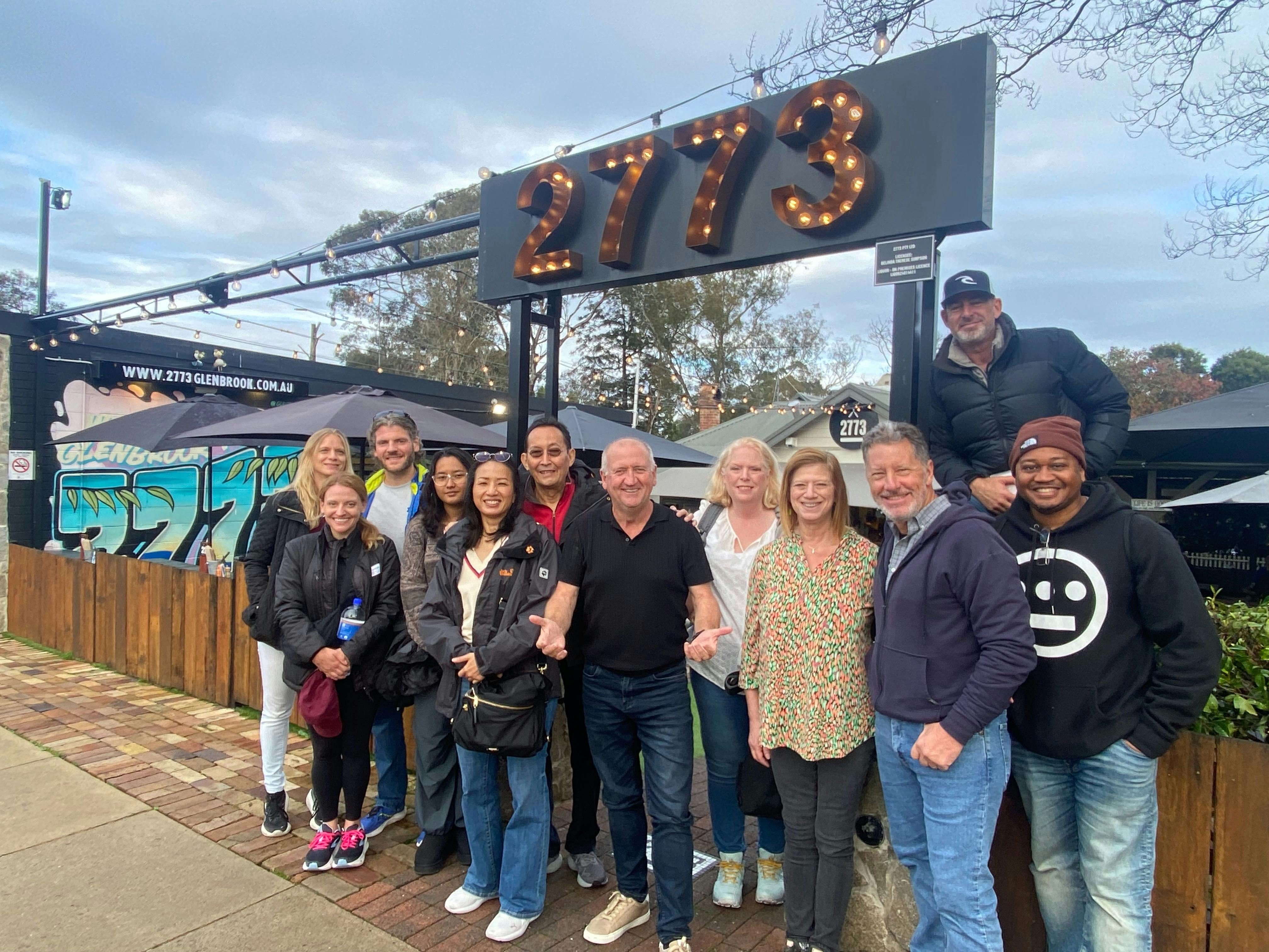 Chapo poses with guests outside one of our restaurant partners after a classic Aussie breakfast