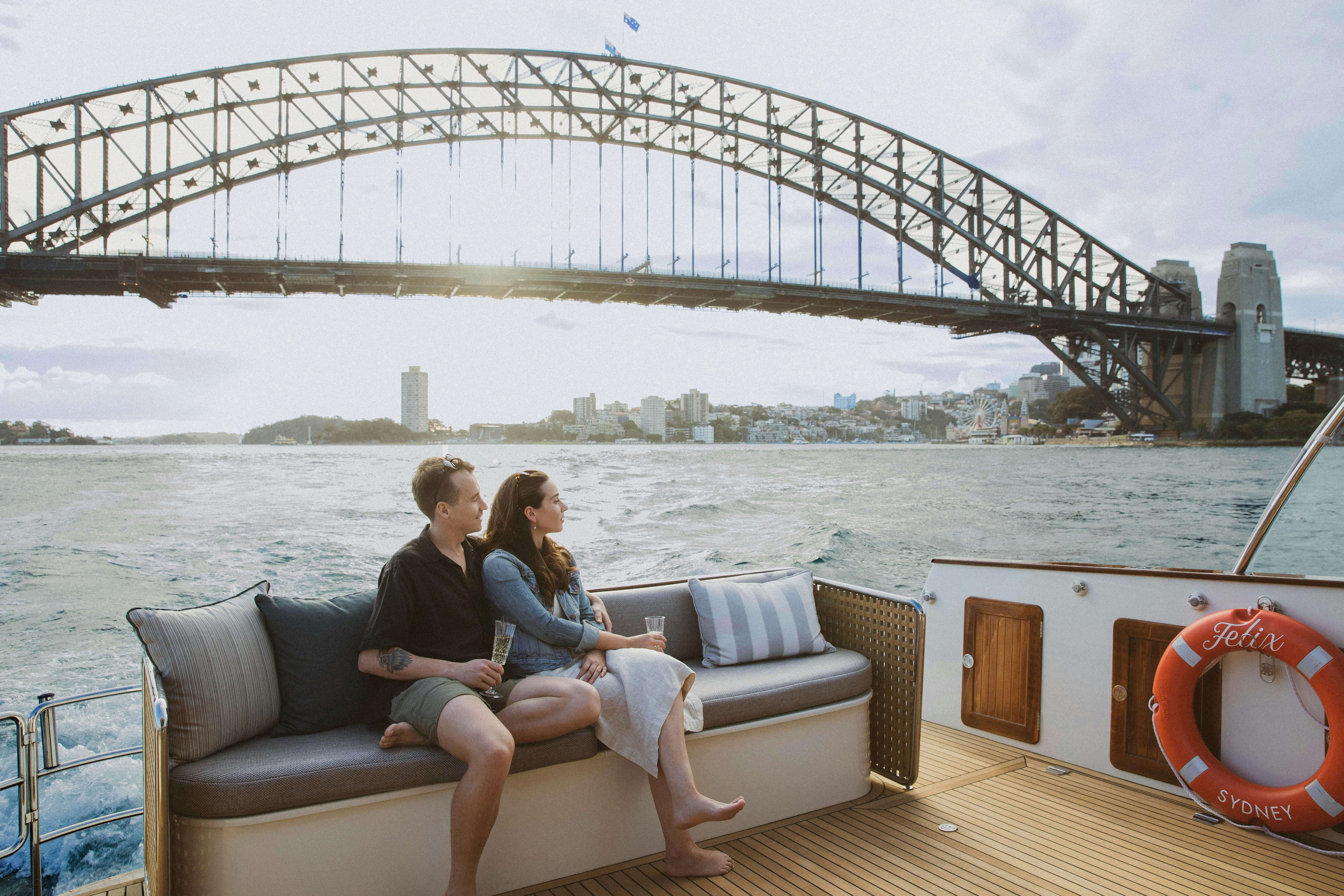 Lifestyle Charter's boat Felix cruises past the Sydney Harbour Bridge