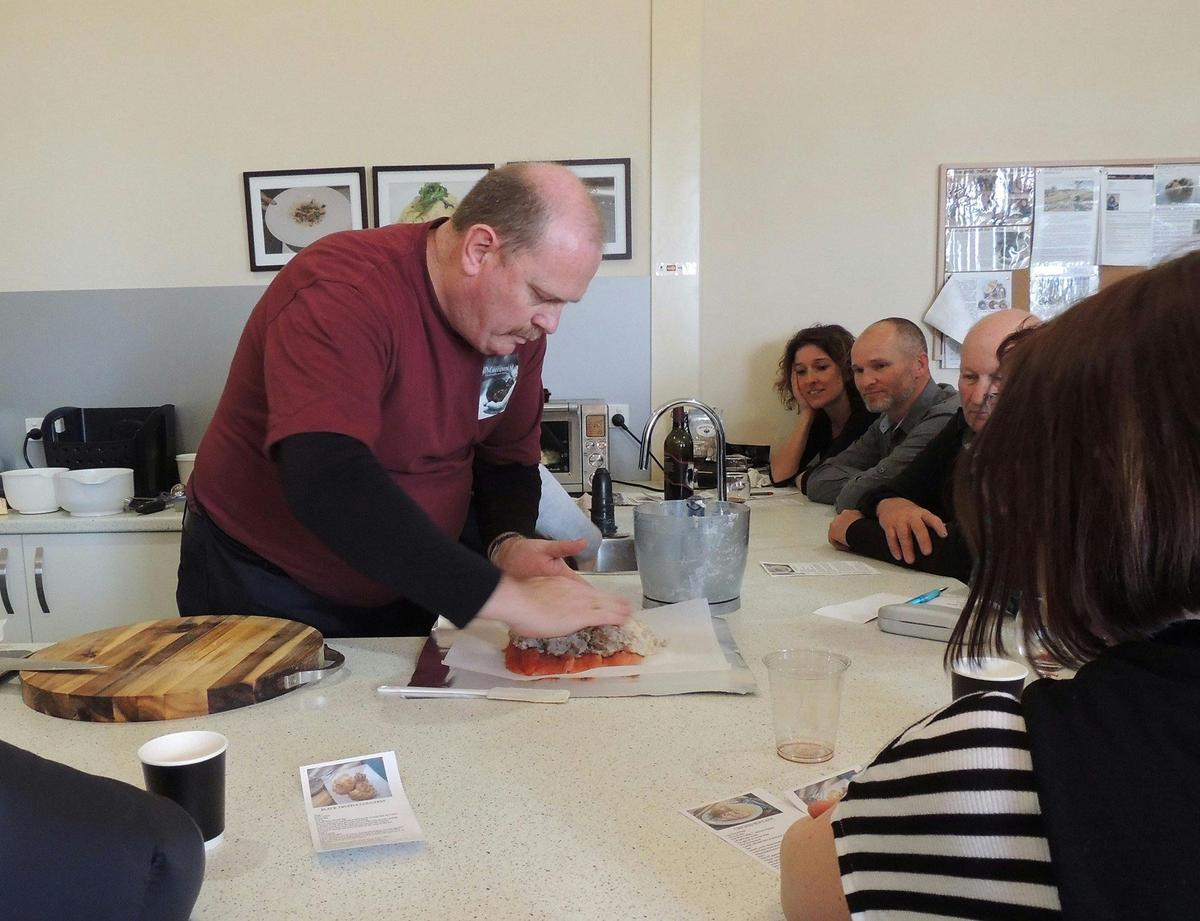 Chef John constructing a Eucumbene truffle trout roulade