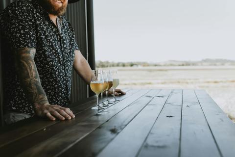 Mudgee Ale trail participant in front of a tasting flight at a local brewery