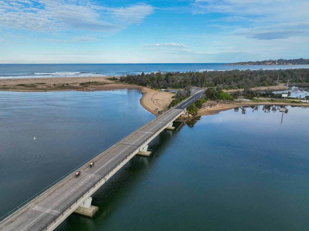 Cycling accross the Mogareeka Bridge, Tathra
