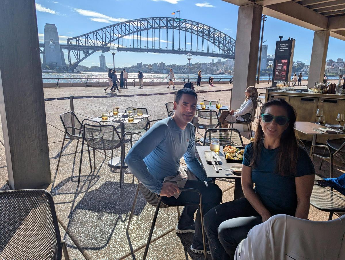 two guests at Midden with Harbour Bridge in background