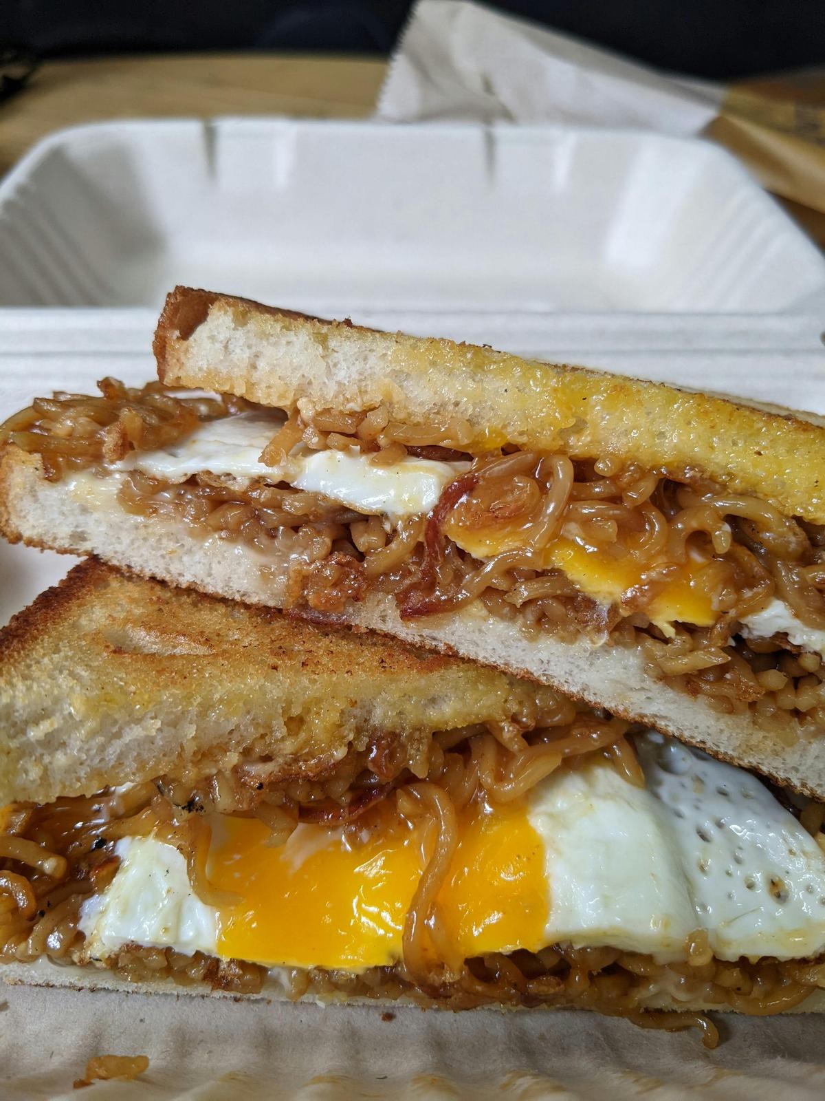 toasted sandwich with mi goreng noodles and fried egg filling