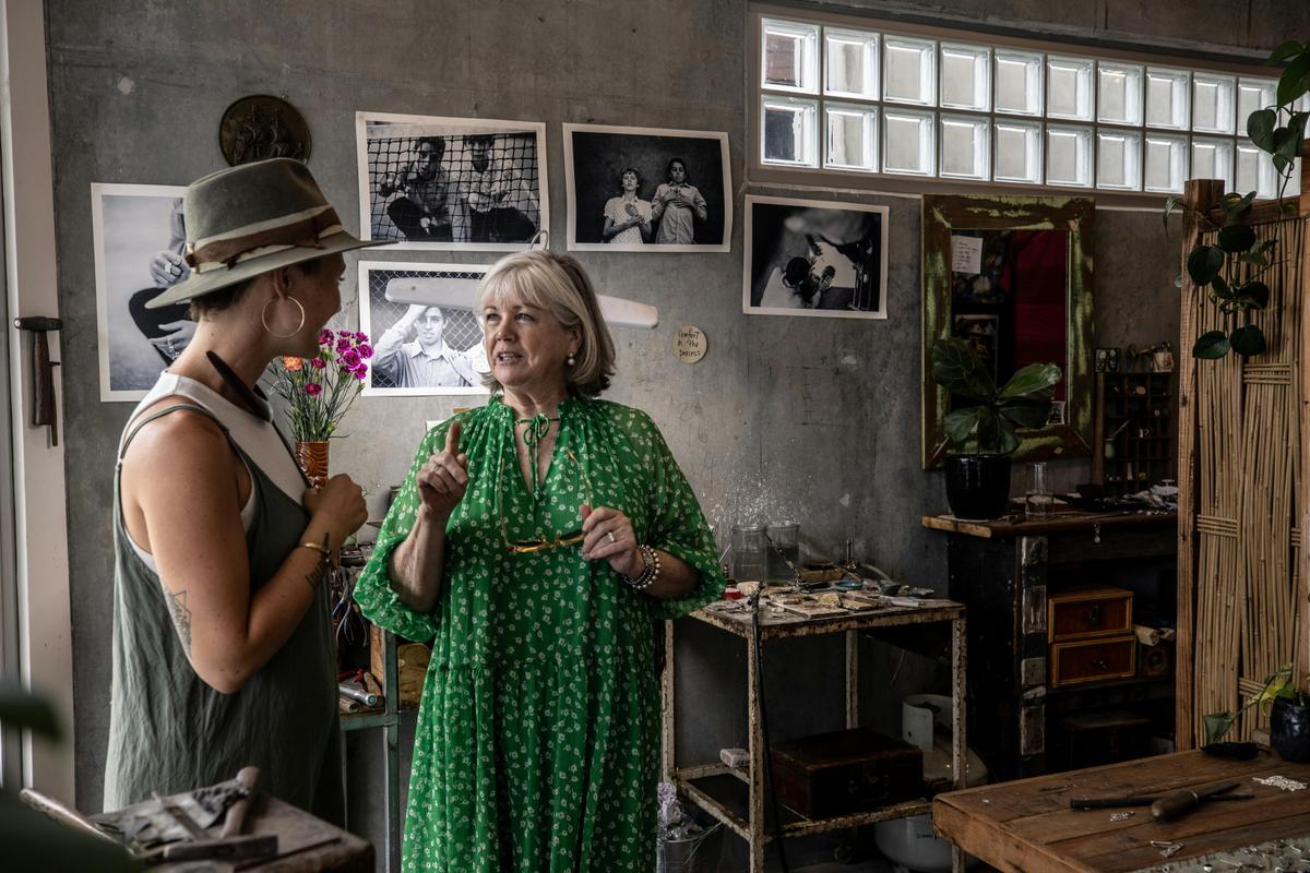 Localing guest and host visiting a local shop in a village.