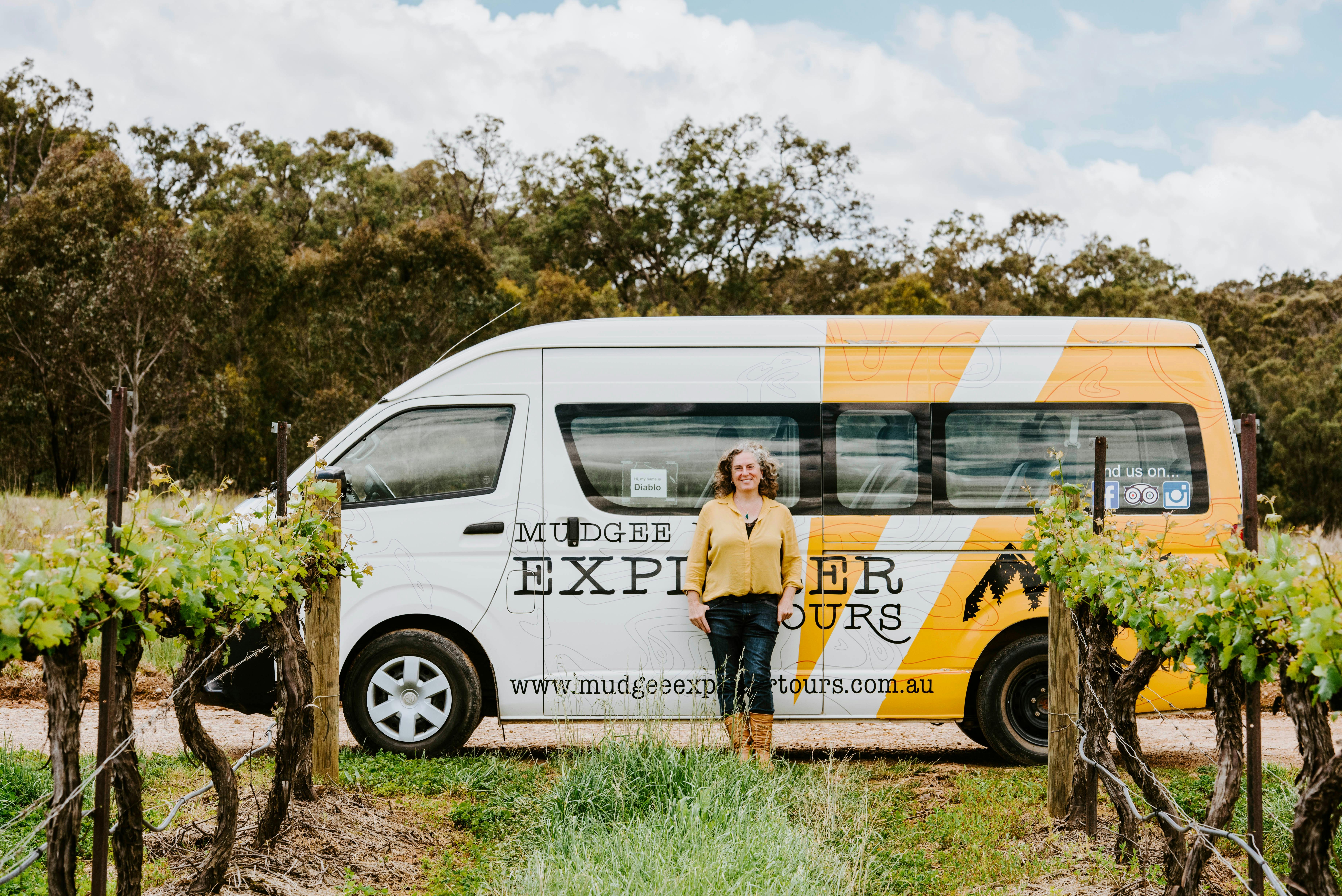 Bronny standing in front of a tour bus