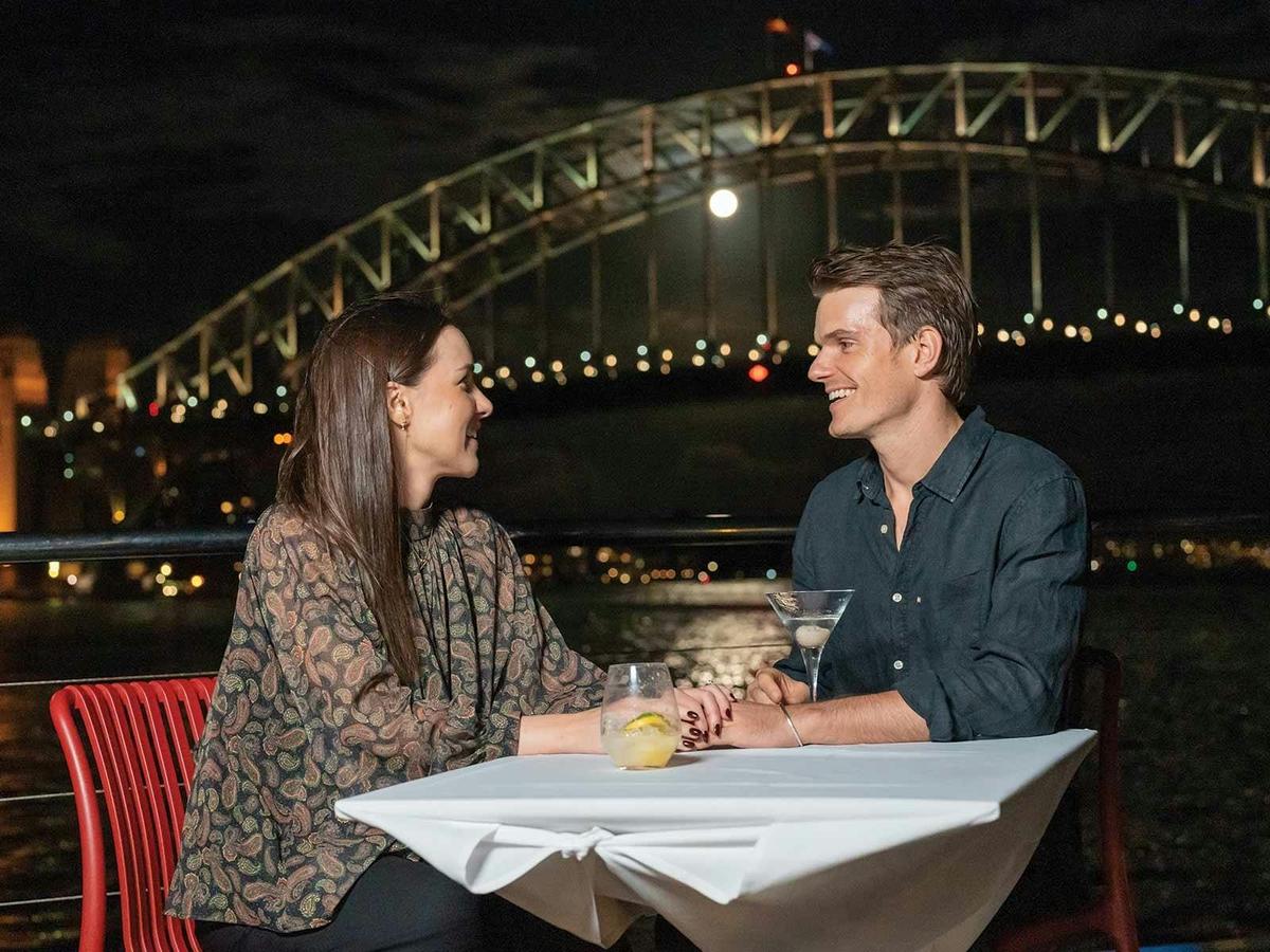 Guests enjoying a romantic date on the Magistic Dinner Cruise