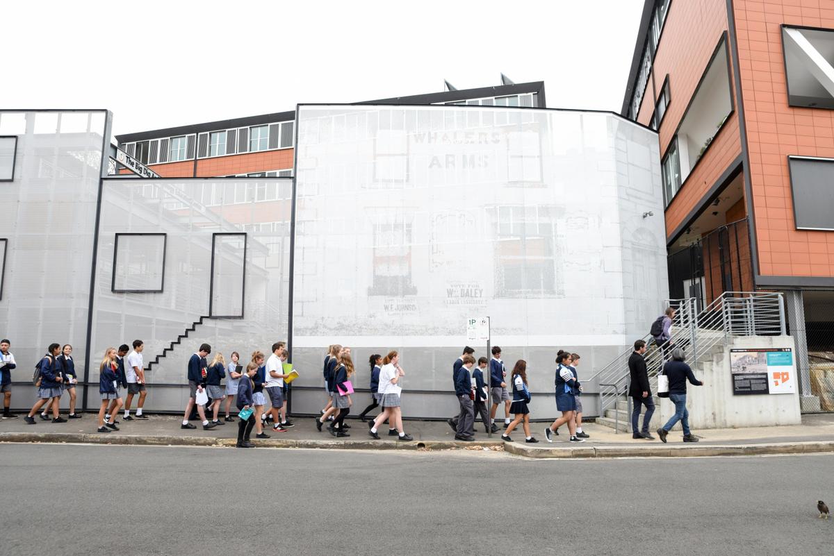 School students outside the archeological dig site visited on Poihākena tours