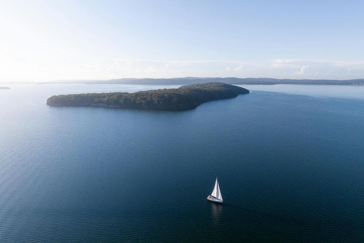 Aerial footage of Sail Lake Macquarie sailing past Pulbah Island