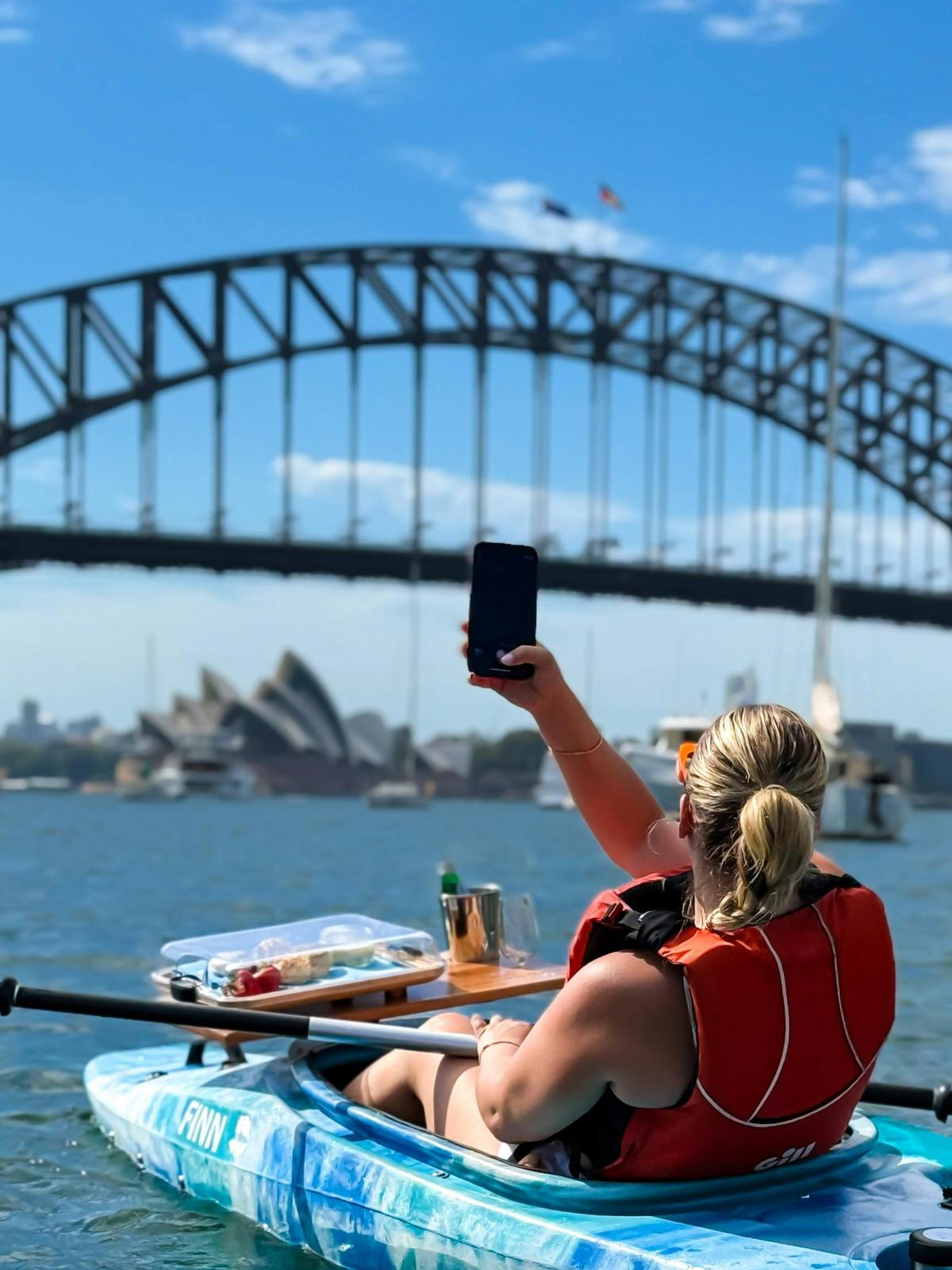 Capture Sydney while enjoying freshly baked scones and tea - right from your kayak!