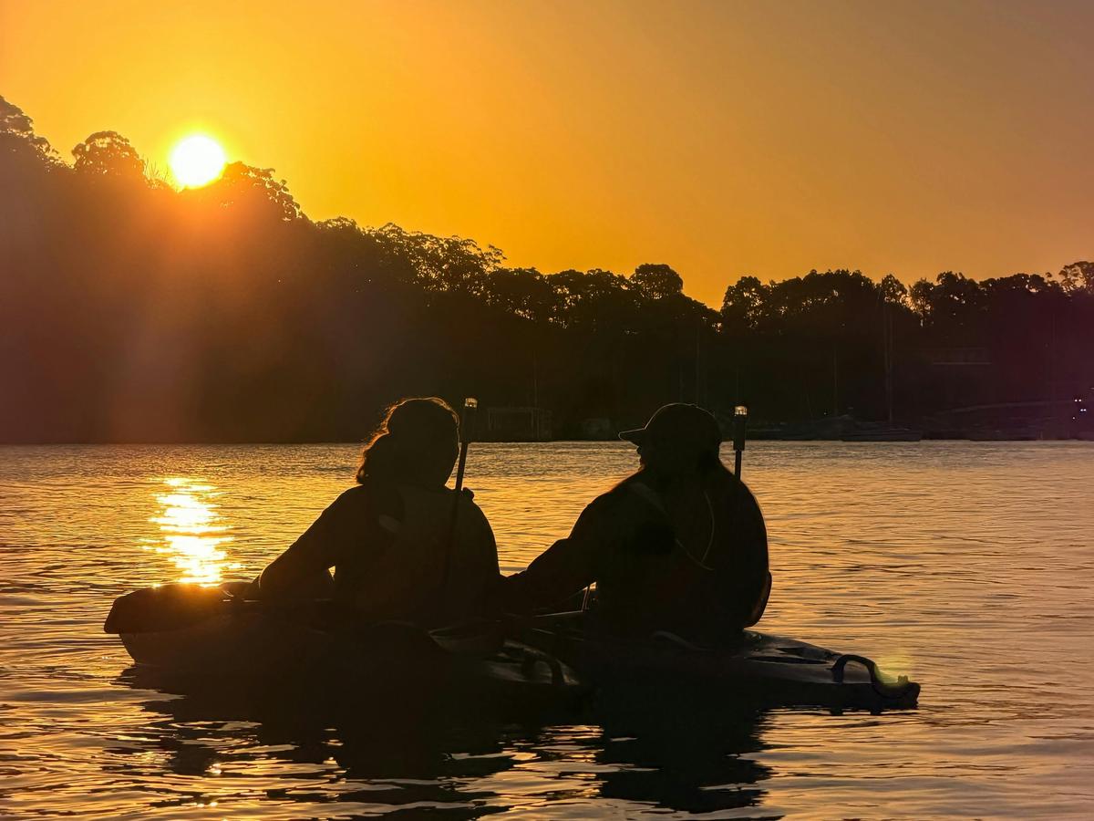 Sydney By Kayak takes beginners and experienced paddlers to see the best sunsets on Sydney Harbour.