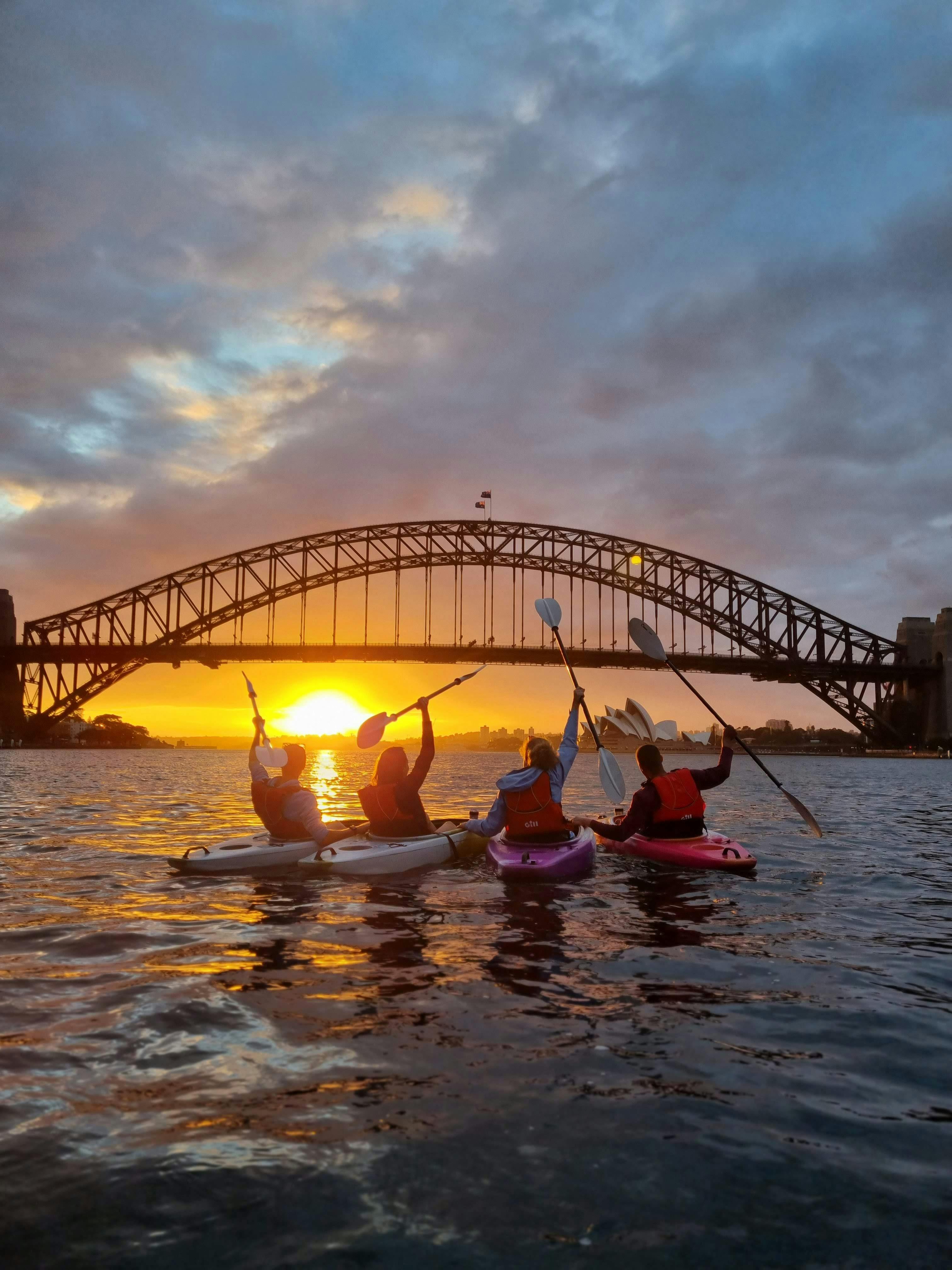 Kayakers celebrating a beautiful sunrise on Sydney Harbour!