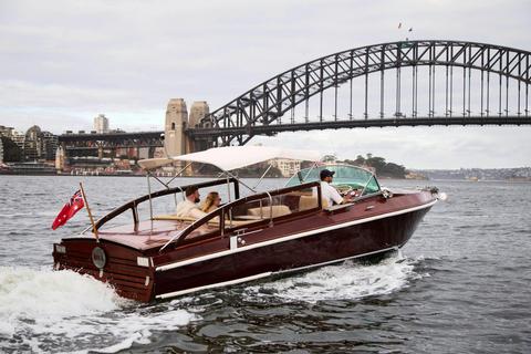 MV BEL private cruise on Sydney Harbour with Sydney city skyline and Harbour Bridge.