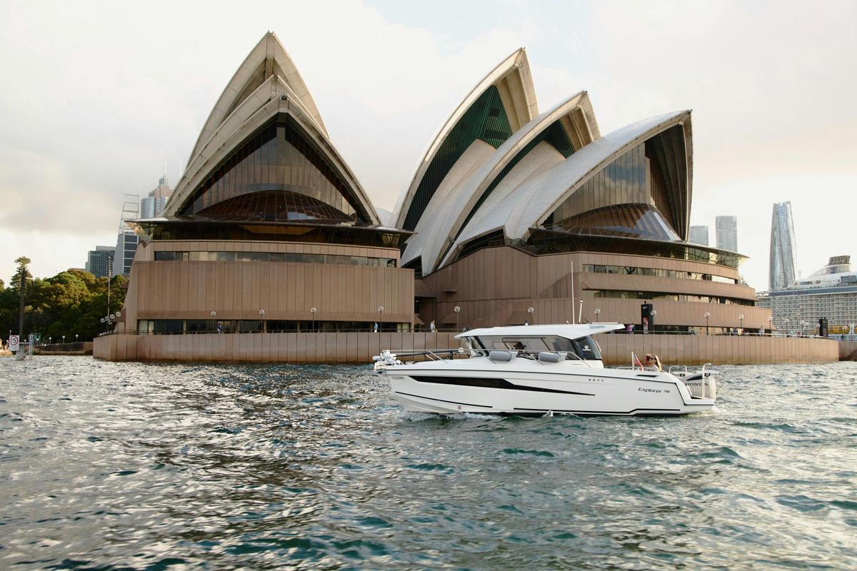 MV Explorer luxury cruise boat on Sydney Harbour with Harbour Bridge in the background.