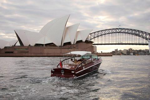 MV BEL private cruise on Sydney Harbour with Sydney city skyline and Harbour Bridge.