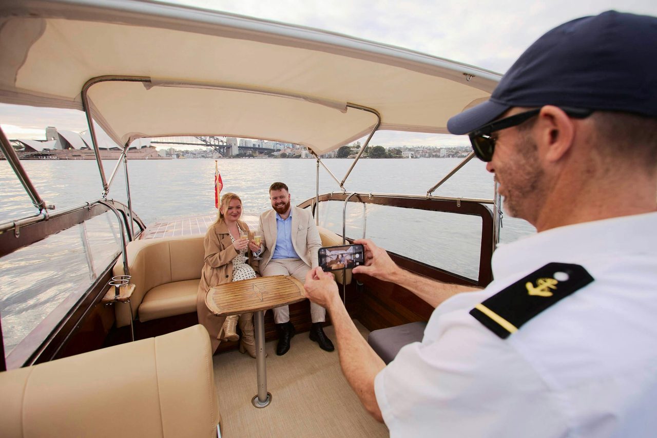 Private boat tour on MV BEL cruising Sydney Harbour with city skyline views.