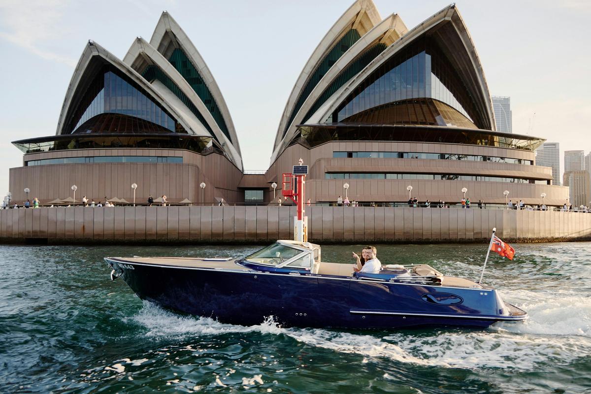 Private boat tour on MV Aquamajestic cruising Sydney Harbour with city skyline views.