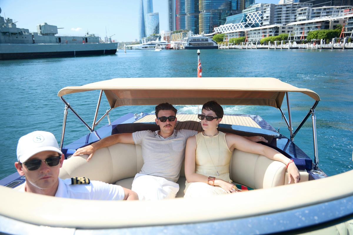 Private boat tour on MV Aquamajestic cruising Sydney Harbour with city skyline views.