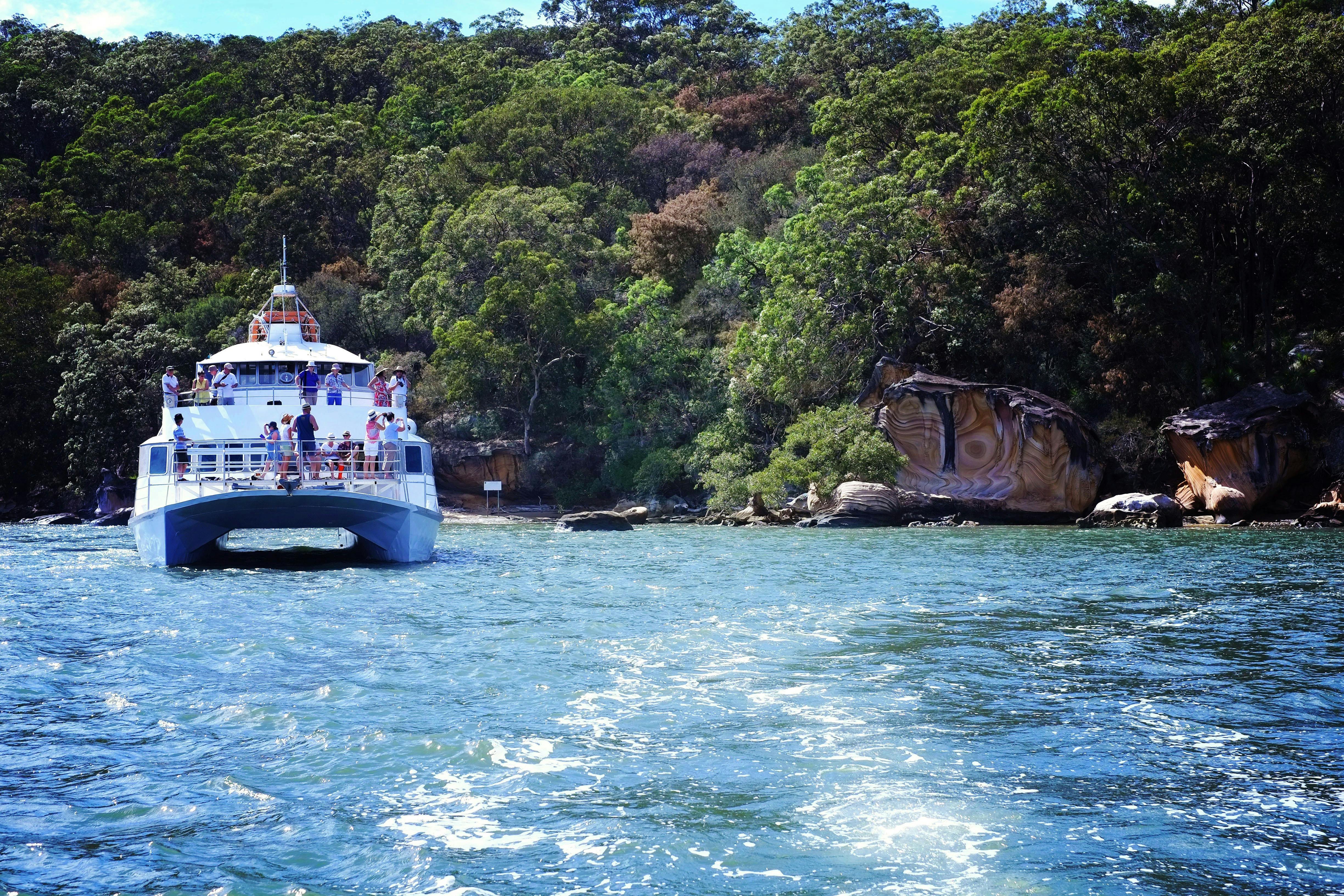 The post boat beside some spectacular Hawkesbury sandstone