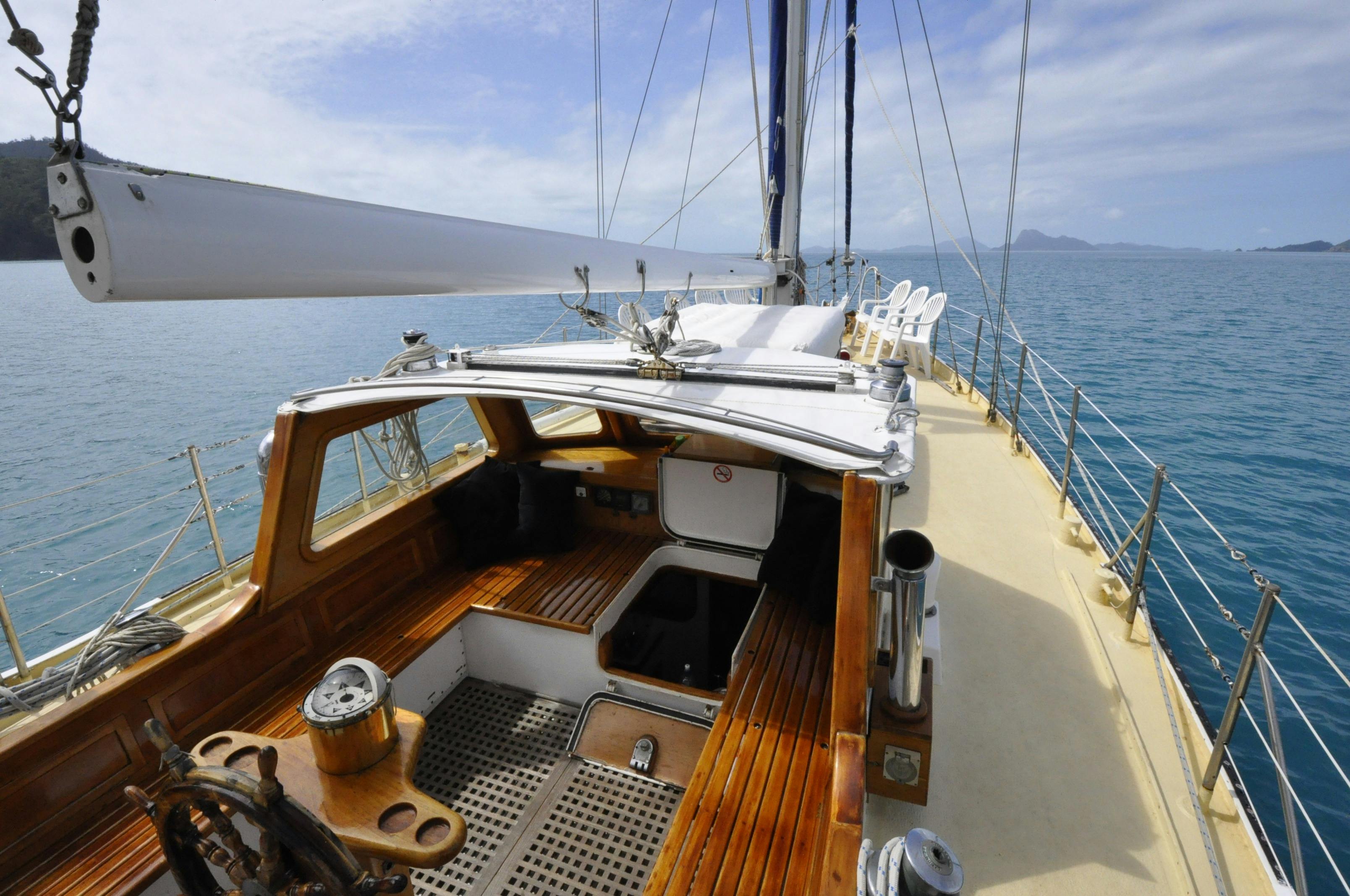 Spacious central cockpit features traditional teak woodwork & wide decks create seafarers ambiance