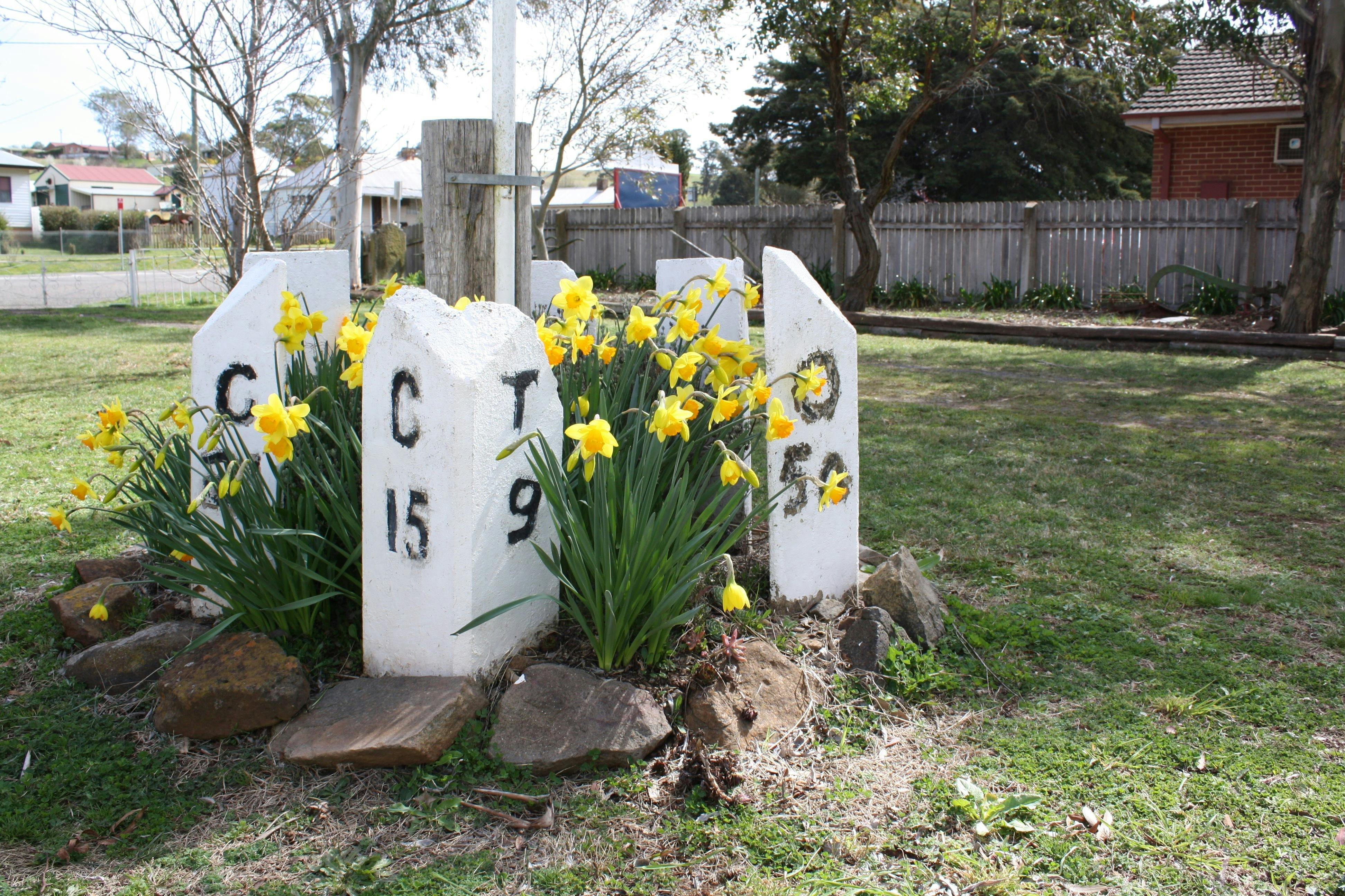Mile posts and flowers