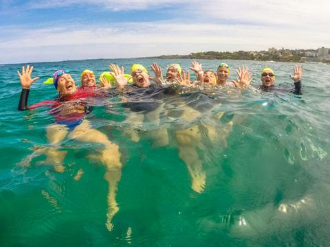 Group ocean swimming at Bondi Beach