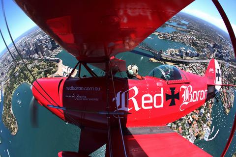 Red Baron biplane over Sydney Harbour