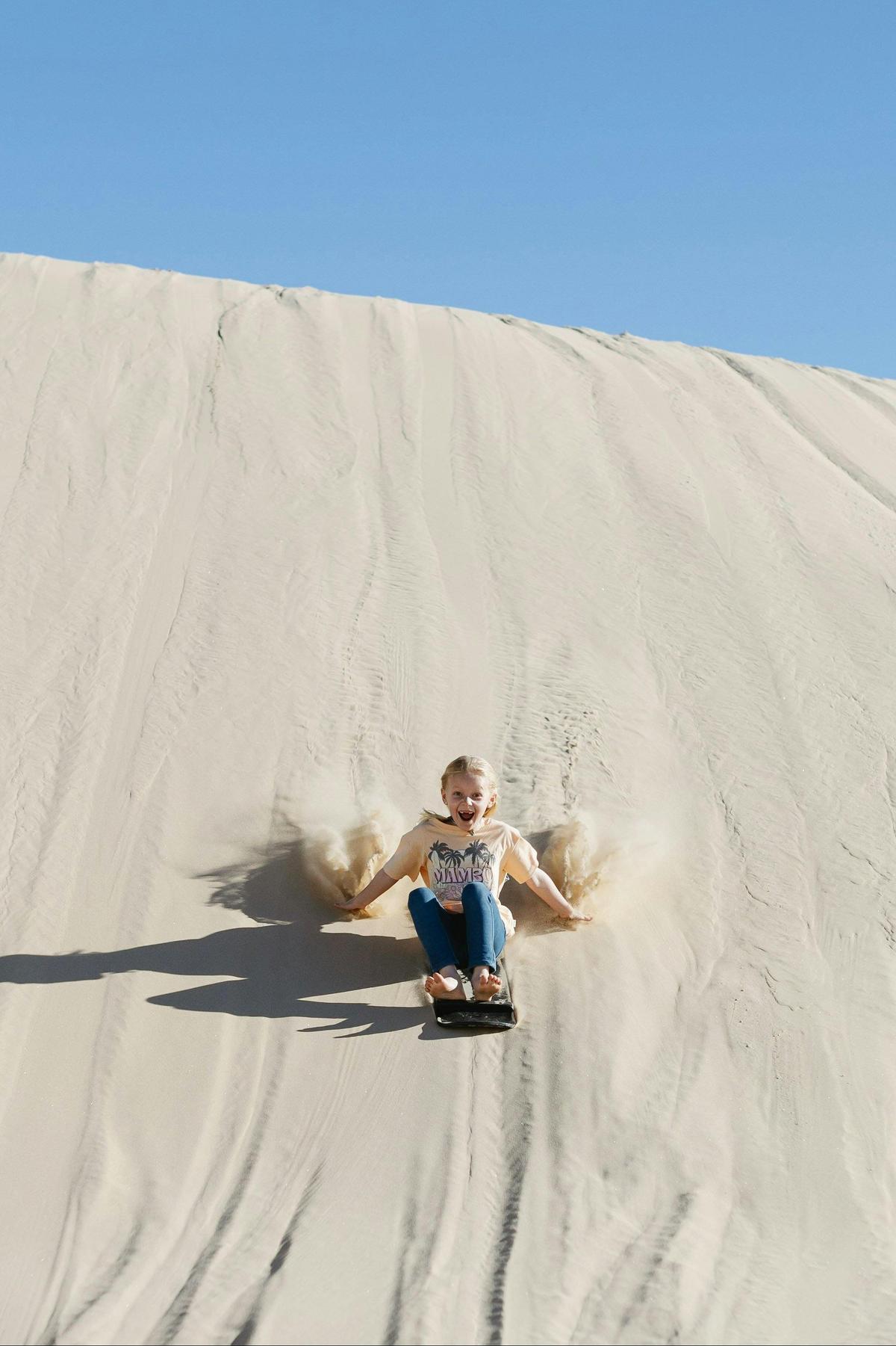 Girl sandboarding