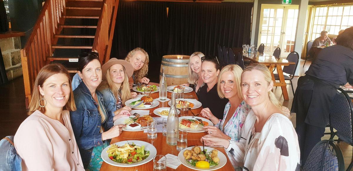 group having lunch at a winery south coast