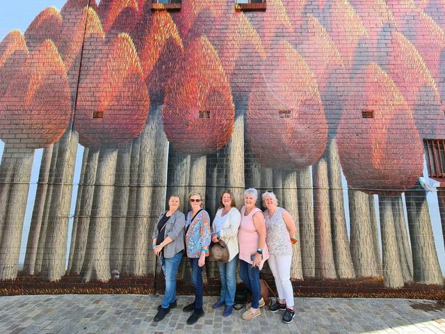 Ladies in front of mural