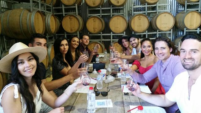 wine tasting among barrels