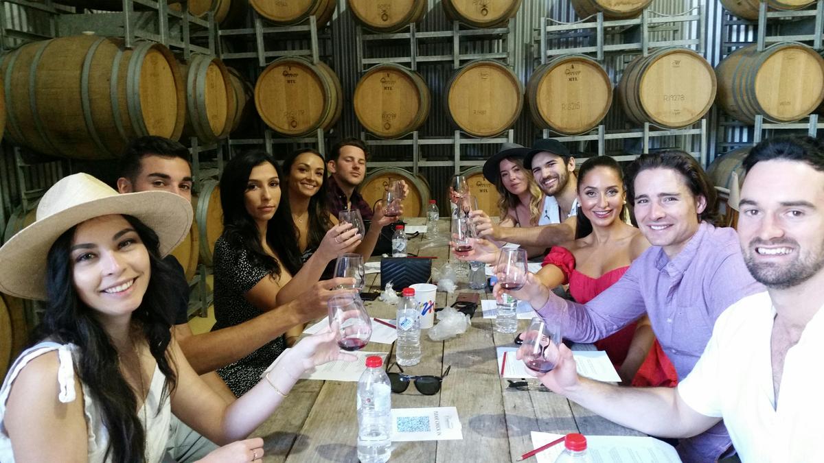 wine tasting among barrels