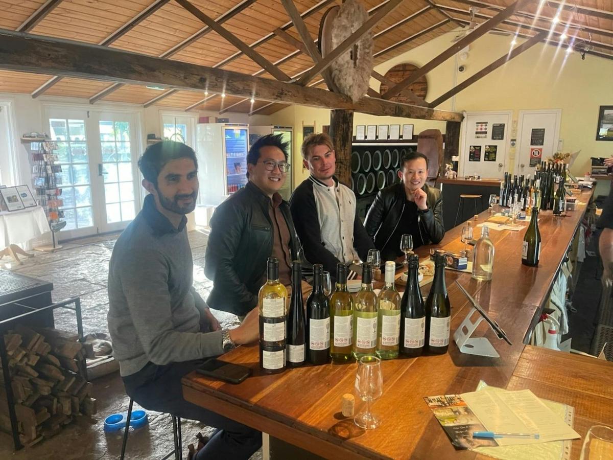 group of 4 men wine tasting