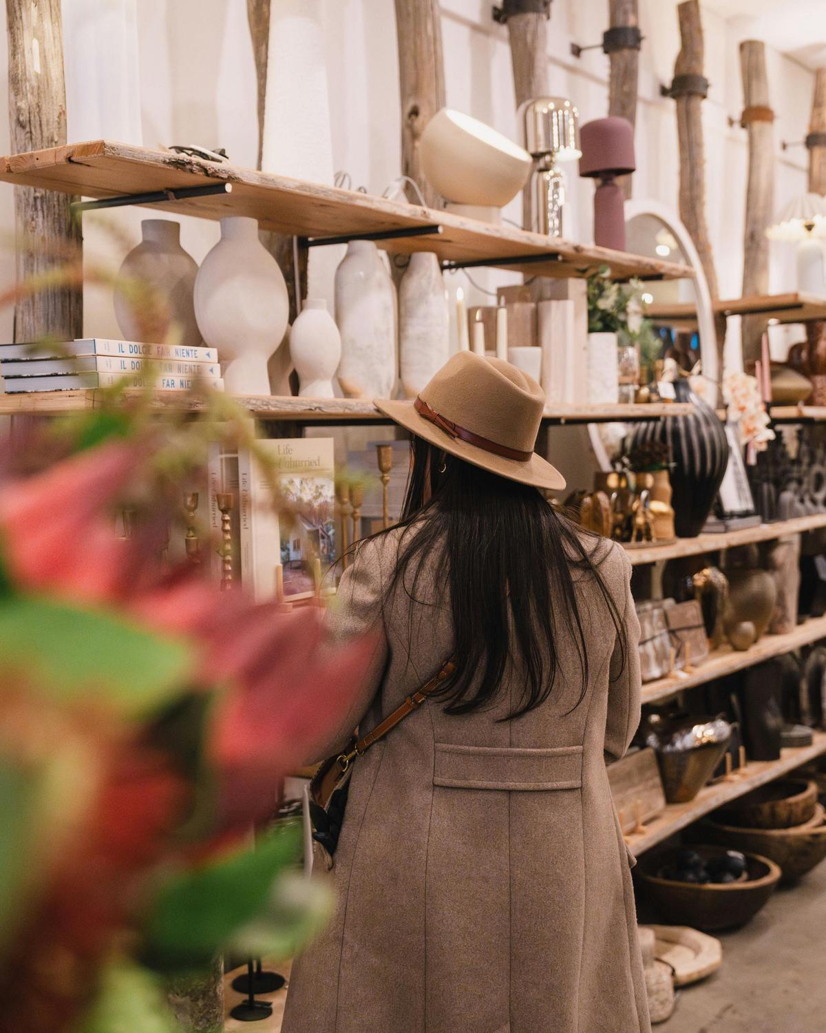 Shopper looking though racks of items
