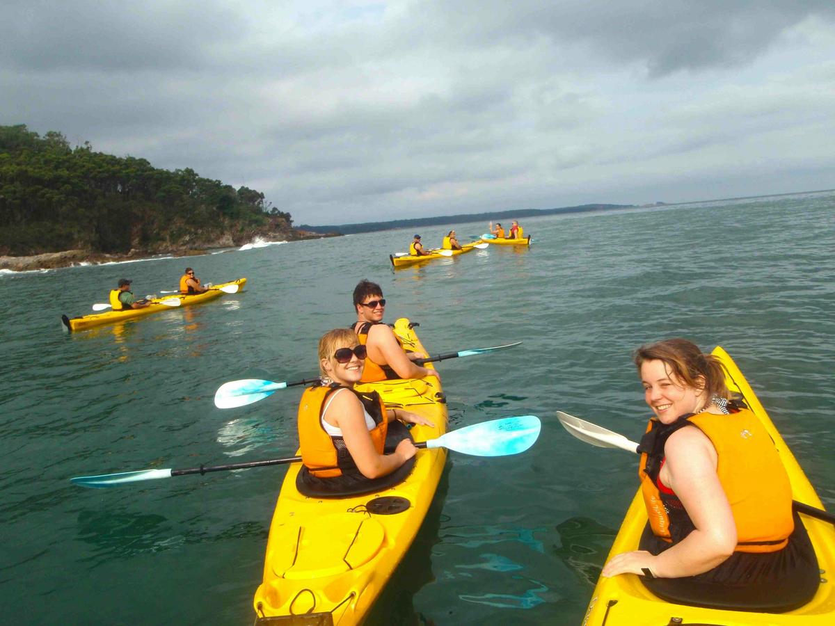 Group paddling around the point