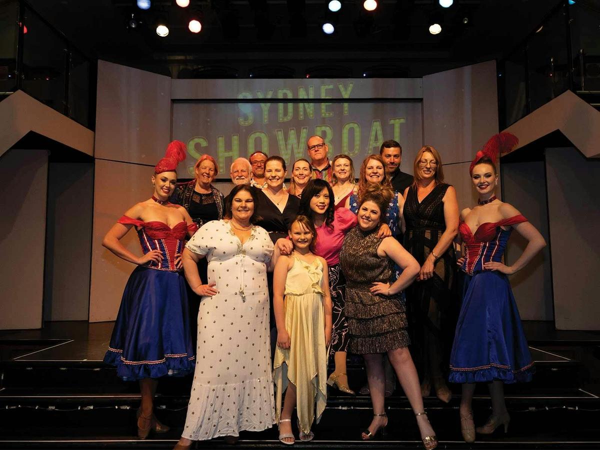 Guests pose with the show girls