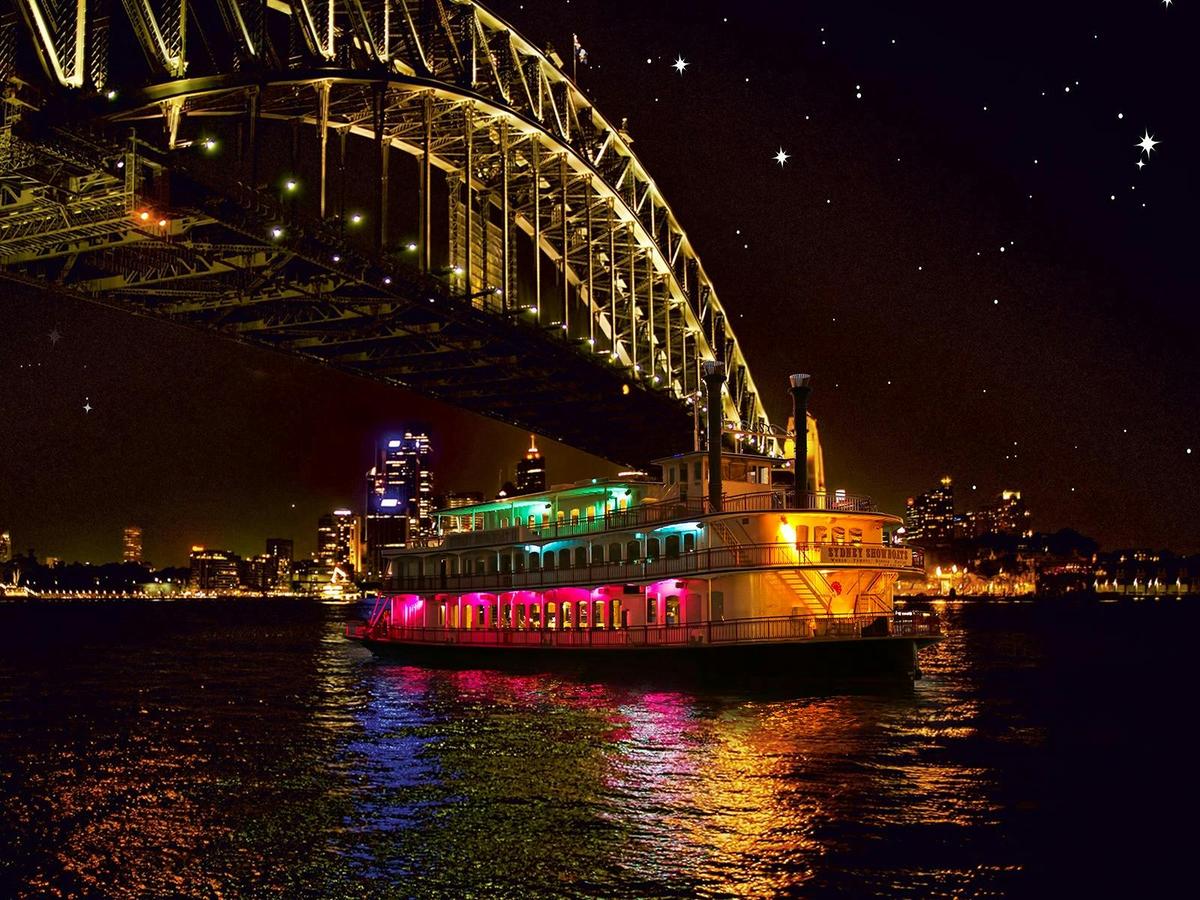 The illuminated 'Showboat II' gliding along the harbour at night is a vision to behold