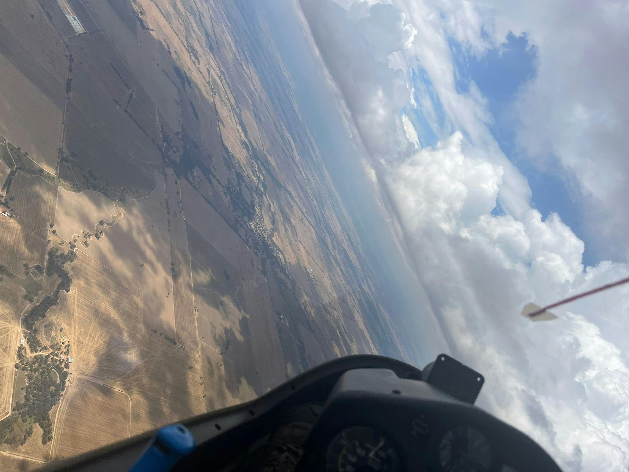 View of horizon on an angle from cockpit of glider