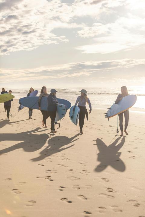 women going surfing