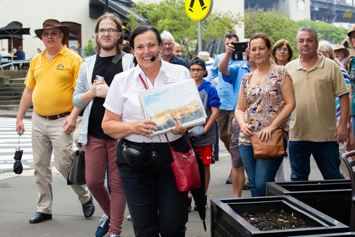 Tour Group walking along Sydney oldest Street - George St.