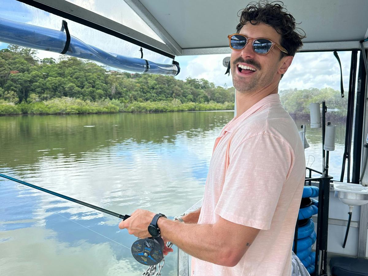 Guest fishing off boat