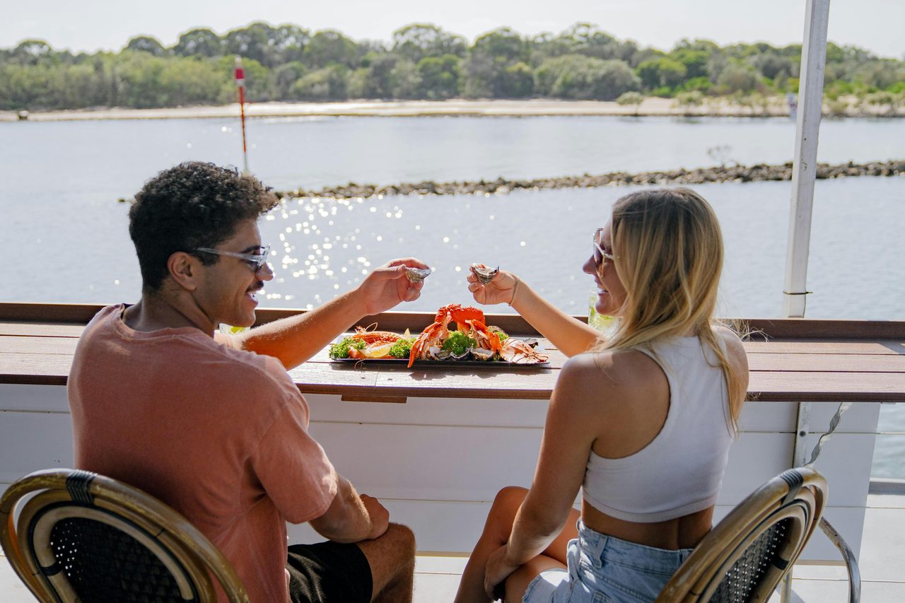 Couple with seafood on river cruise
