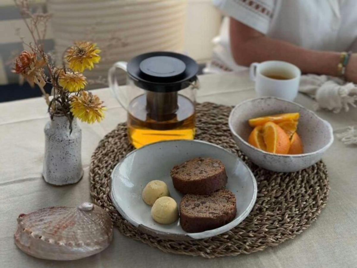 Morning tea featuring lemon myrtle tea, and local bakery goods.
